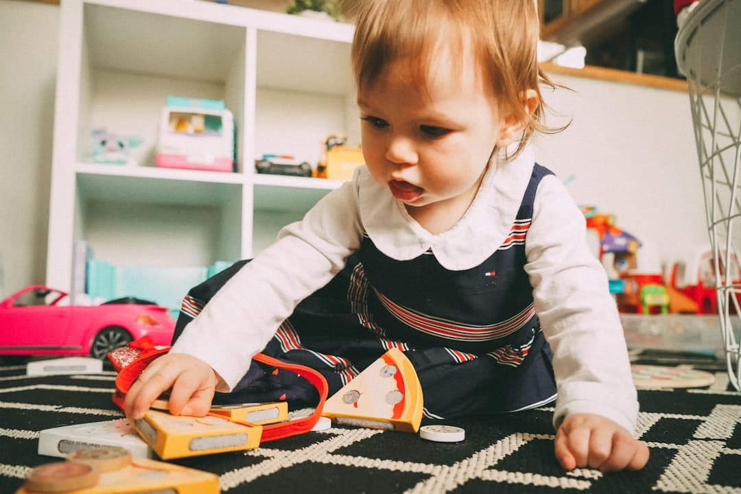 Toddler exploring and learning in a bright playroom